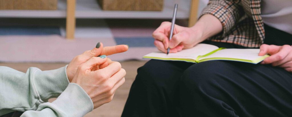 doctor writing notes about patient