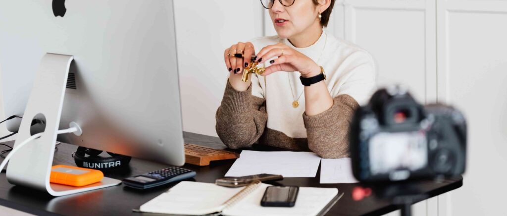 a woman Infront of her computer