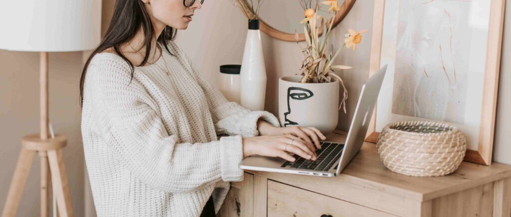 lady typing on her laptop